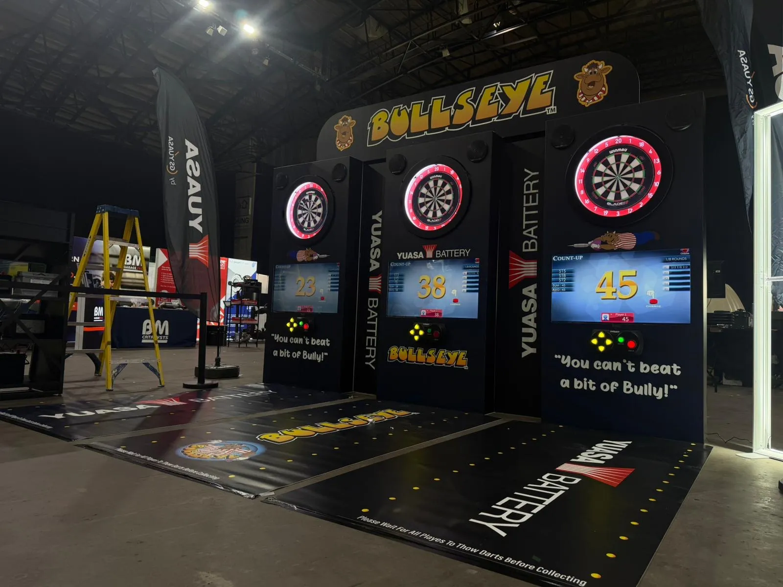Three-lane branded darts wall at an exhibition