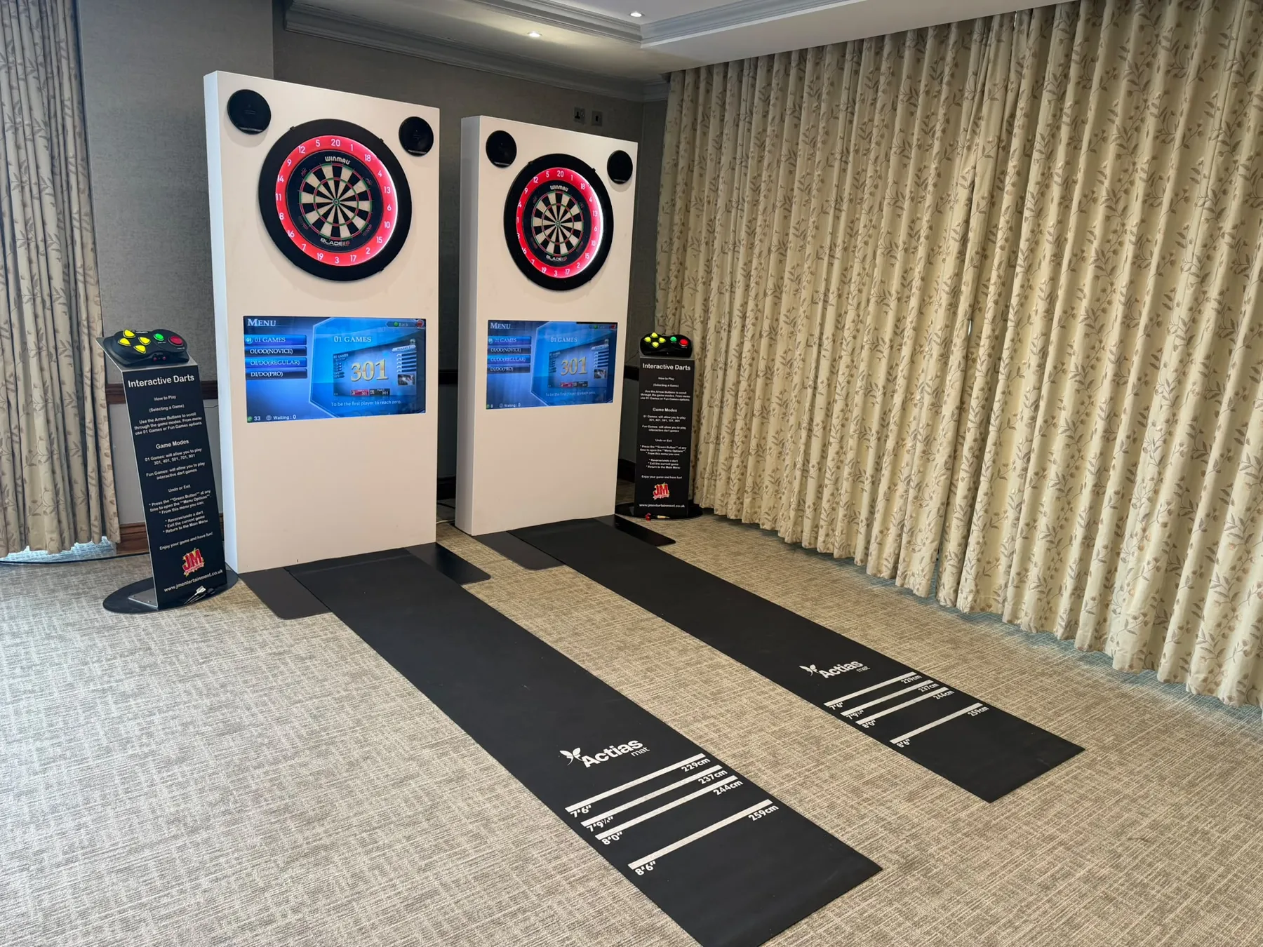 Interactive dartboards at a hotel event