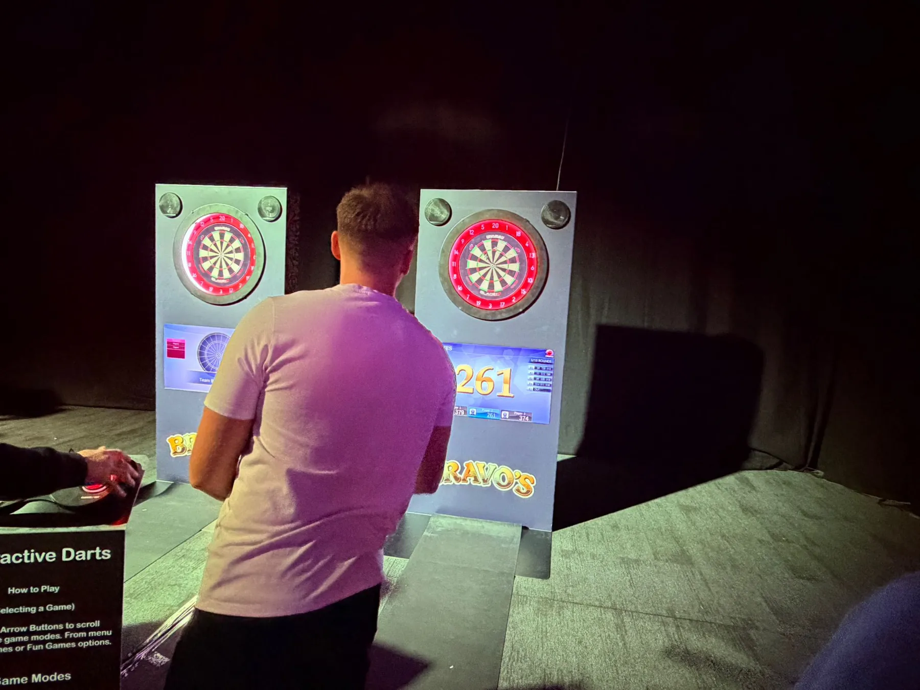 Guest playing interactive darts with live scoring